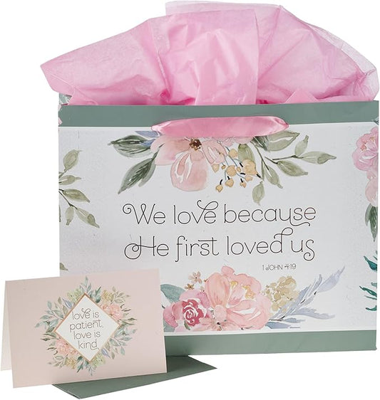 Christian Art Gifts Large Landscape Scripture Gift Bag w/Blank Greeting Card & Wrapping Tissue Paper Set: He First Loved Us Inspirational Bible Verse, Beautiful Floral Design w/Gold for Birthdays,