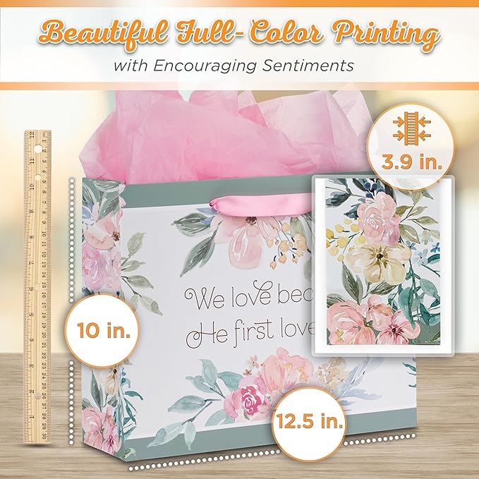 Christian Art Gifts Large Landscape Scripture Gift Bag w/Blank Greeting Card & Wrapping Tissue Paper Set: He First Loved Us Inspirational Bible Verse, Beautiful Floral Design w/Gold for Birthdays,