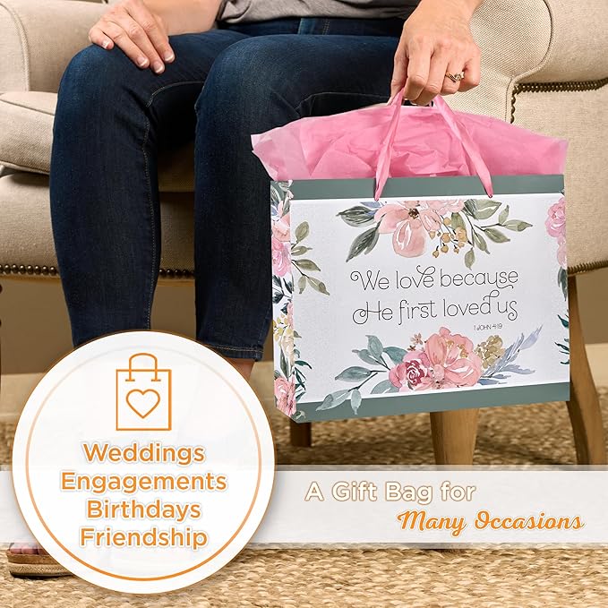 Christian Art Gifts Large Landscape Scripture Gift Bag w/Blank Greeting Card & Wrapping Tissue Paper Set: He First Loved Us Inspirational Bible Verse, Beautiful Floral Design w/Gold for Birthdays,